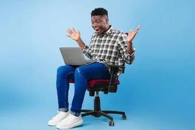 A young Nigerian professional at his laptop after a remote offer
